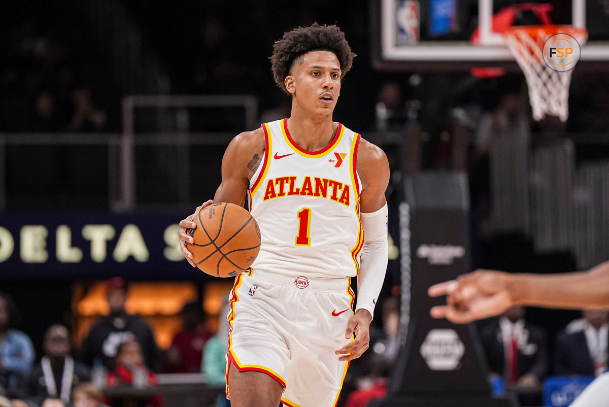 Oct 8, 2024; Atlanta, Georgia, USA; Atlanta Hawks forward Jalen Johnson (1) brings the ball up the court against the Indiana Pacers during the first half at State Farm Arena. Credit: Dale Zanine-Imagn Images