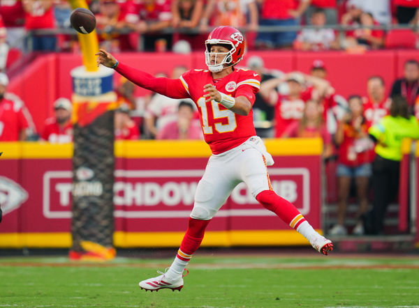 Sep 15, 2024; Kansas City, Missouri, USA; Kansas City Chiefs quarterback Patrick Mahomes (15) throws a pass during the second half against the Cincinnati Bengals at GEHA Field at Arrowhead Stadium. Mandatory Credit: Jay Biggerstaff-Imagn Images