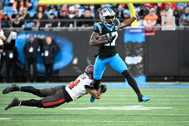 Dec 1, 2024; Charlotte, North Carolina, USA;  Carolina Panthers wide receiver Xavier Legette (17) with the ball as Tampa Bay Buccaneers safety Antoine Winfield Jr. (31) defends in the second quarter at Bank of America Stadium. Credit: Bob Donnan-Imagn Images