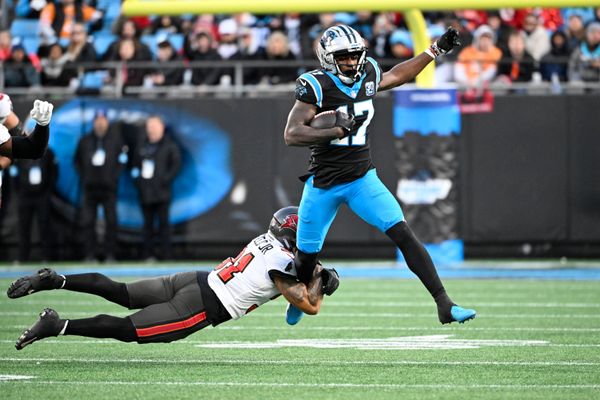 Dec 1, 2024; Charlotte, North Carolina, USA;  Carolina Panthers wide receiver Xavier Legette (17) with the ball as Tampa Bay Buccaneers safety Antoine Winfield Jr. (31) defends in the second quarter at Bank of America Stadium. Mandatory Credit: Bob Donnan-Imagn Images