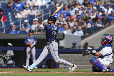 May 15, 2025; Toronto, Ontario, CAN; Tampa Bay Rays second base Josh Lowe (15) hits a home run against the Toronto Blue Jays during the fifth inning at Rogers Centre. Mandatory Credit: Kevin Sousa-Imagn Images