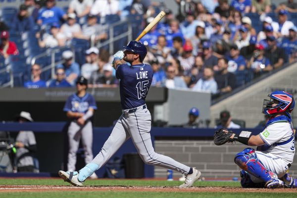 May 15, 2025; Toronto, Ontario, CAN; Tampa Bay Rays second base Josh Lowe (15) hits a home run against the Toronto Blue Jays during the fifth inning at Rogers Centre. Mandatory Credit: Kevin Sousa-Imagn Images