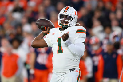 Nov 30, 2024; Syracuse, New York, USA; Miami Hurricanes quarterback Cam Ward (1) passes the ball against the Syracuse Orange during the first half at the JMA Wireless Dome. Mandatory Credit: Rich Barnes-Imagn Images