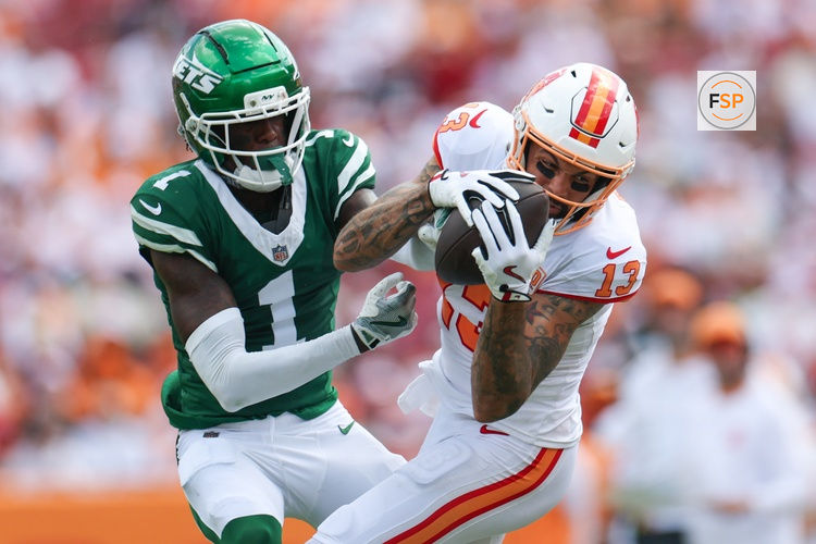 Sep 21, 2025; Tampa, Florida, USA; Tampa Bay Buccaneers wide receiver Mike Evans (13) catches pass defended boy New York Jets cornerback Sauce Gardner (1) in the third quarter at Raymond James Stadium. Credit: Nathan Ray Seebeck-Imagn Images