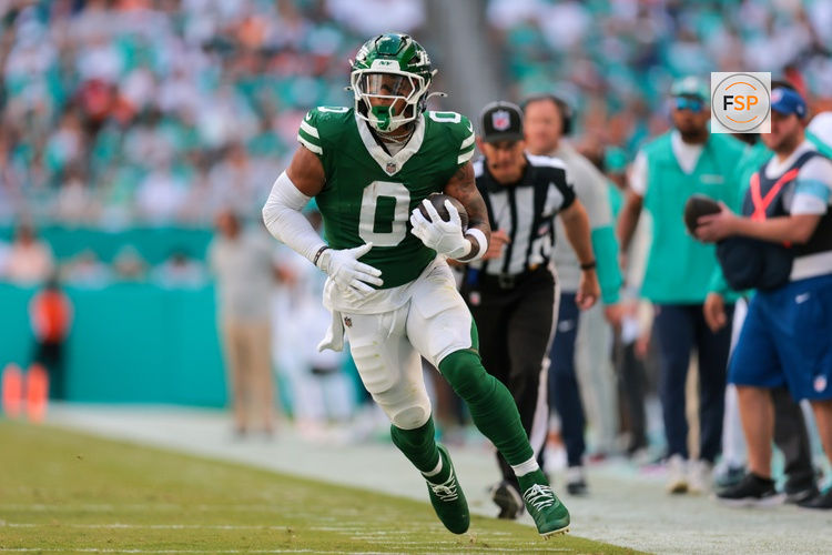 Dec 8, 2024; Miami Gardens, Florida, USA; New York Jets running back Braelon Allen (0) runs with the football against the Miami Dolphins during the first quarter at Hard Rock Stadium. Credit: Sam Navarro-Imagn Images