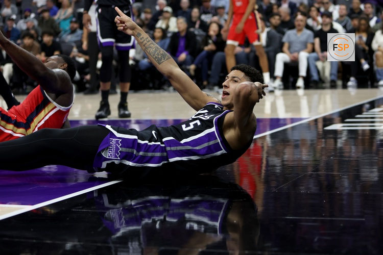Mar 5, 2026; Sacramento, California, USA; Sacramento Kings guard Nique Clifford (5) signals a charging call against the New Orleans Pelicans during the second quarter at Golden 1 Center. Credit: Dennis Lee-Imagn Images