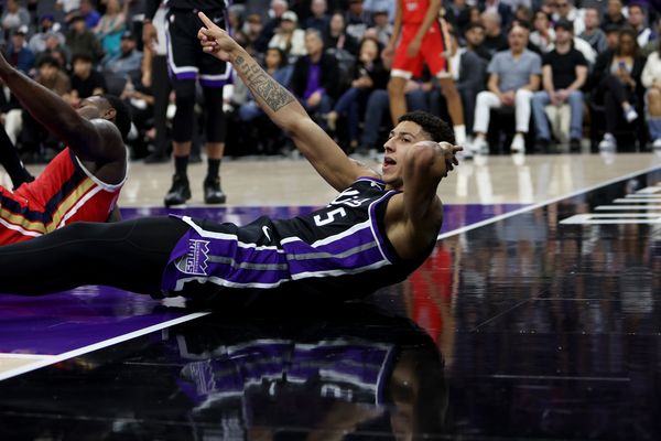 Mar 5, 2026; Sacramento, California, USA; Sacramento Kings guard Nique Clifford (5) signals a charging call against the New Orleans Pelicans during the second quarter at Golden 1 Center. Mandatory Credit: Dennis Lee-Imagn Images