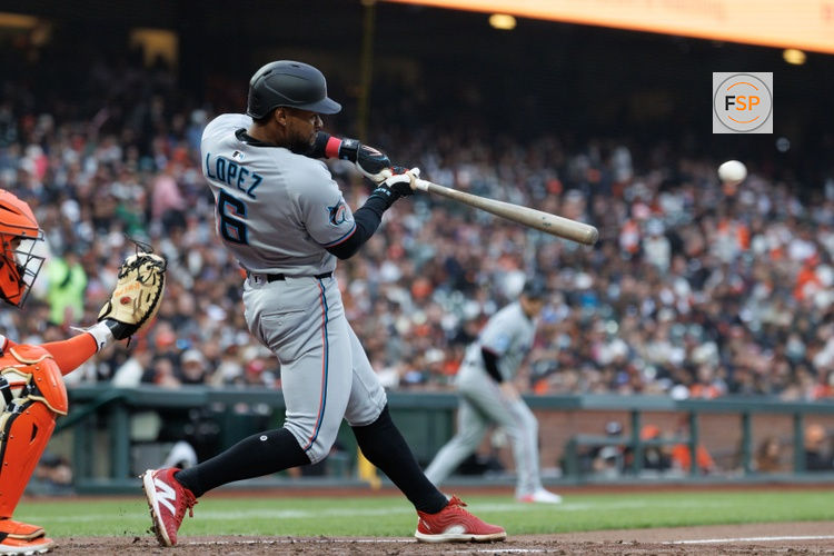 Jun 25, 2025; San Francisco, California, USA; Miami Marlins shortstop Otto Lopez (6) a hits a two run RBI double at during the fourth inning against the San Francisco Giants during the fourth inning at Oracle Park. Lopez was tagged out at third base. Credit: Sergio Estrada-Imagn Images
