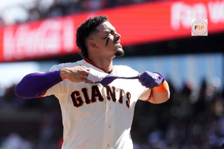 Mar 27, 2026; San Francisco, California, USA; San Francisco Giants shortstop Willy Adames (2) removes his batting glove after striking out against the New York Yankees during the fifth inning at Oracle Park. Credit: Darren Yamashita-Imagn Images