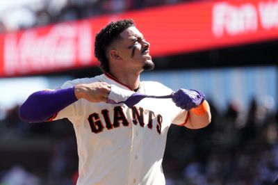 Mar 27, 2026; San Francisco, California, USA; San Francisco Giants shortstop Willy Adames (2) removes his batting glove after striking out against the New York Yankees during the fifth inning at Oracle Park. Mandatory Credit: Darren Yamashita-Imagn Images