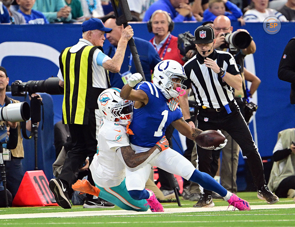 Oct 20, 2024; Indianapolis, Indiana, USA; Indianapolis Colts wide receiver Josh Downs (1) is tackled by Miami Dolphins cornerback Jalen Ramsey (5) during the second half at Lucas Oil Stadium. Credit: Marc Lebryk-Imagn Images