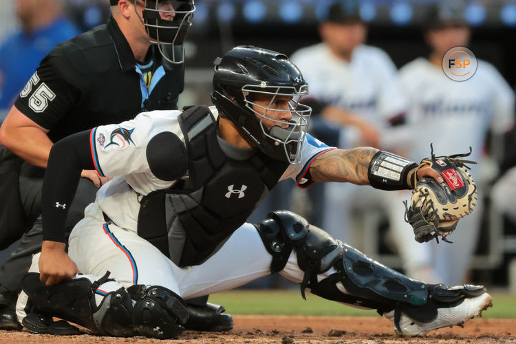 Apr 21, 2025; Miami, Florida, USA; Miami Marlins catcher Agustin Ramirez (50) plays his position against the Cincinnati Reds during the third inning at loanDepot Park. Credit: Sam Navarro-Imagn Images
