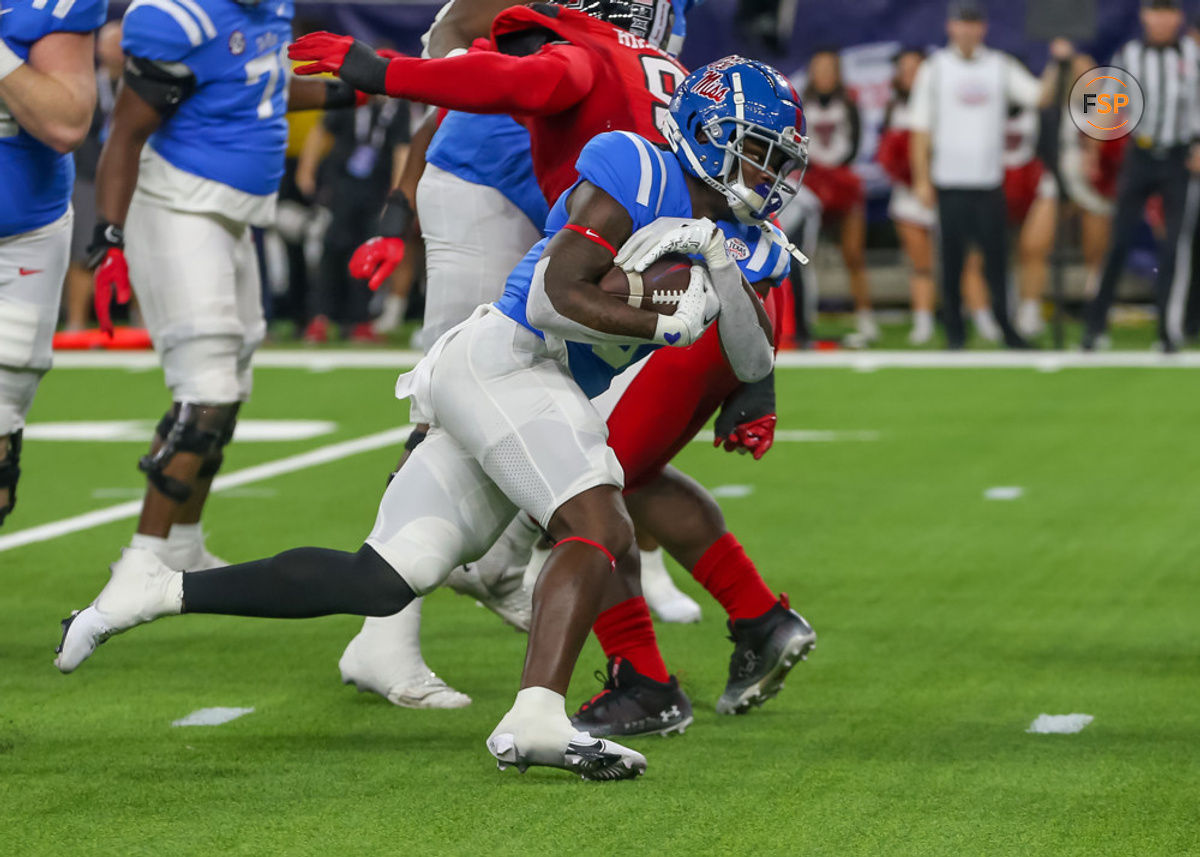 HOUSTON, TX - DECEMBER 28:  Mississippi Rebels running back Zach Evans (6) carries the ball in the first quarter during the TaxAct Texas Bowl between the Texas Tech Red Raiders and Ole Miss Rebels on December 28, 2022 at NRG Stadium in Houston, Texas.  (Photo by Leslie Plaza Johnson/Icon Sportswire)