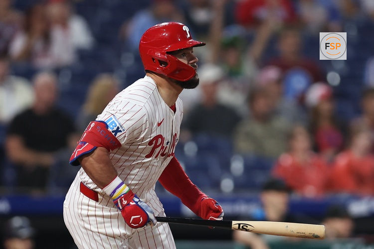 Sep 24, 2025; Philadelphia, Pennsylvania, USA; Philadelphia Phillies outfielder Kyle Schwarber (12) hits a double during the first inning against the Miami Marlins at Citizens Bank Park. Credit: Bill Streicher-Imagn Images