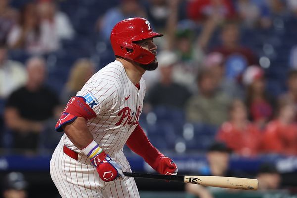 Sep 24, 2025; Philadelphia, Pennsylvania, USA; Philadelphia Phillies outfielder Kyle Schwarber (12) hits a double during the first inning against the Miami Marlins at Citizens Bank Park. Mandatory Credit: Bill Streicher-Imagn Images