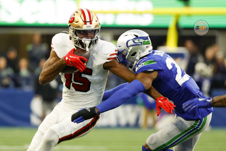 Oct 10, 2024; Seattle, Washington, USA; San Francisco 49ers wide receiver Jauan Jennings (15) runs for yards after the catch against Seattle Seahawks cornerback Tre Brown (22) during the second quarter at Lumen Field. Credit: Joe Nicholson-Imagn Images