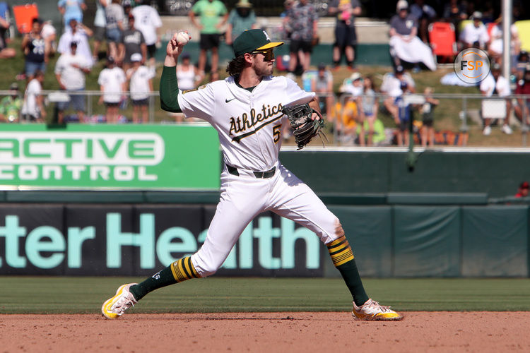 May 10, 2025; West Sacramento, California, USA; Athletics short stop Jacob Wilson (5) throws to first on a routine grounder hit by New York Yankees designated hitter Aaron Judge (not pictured) during the ninth inning at Sutter Health Park. Credit: Dennis Lee-Imagn Images
