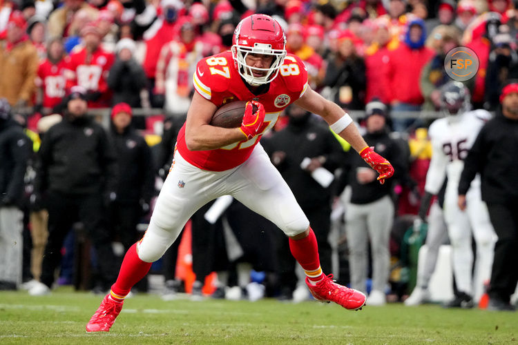 Jan 18, 2025; Kansas City, Missouri, USA; Kansas City Chiefs tight end Travis Kelce (87) runs the ball after a pass reception against the Houston Texans during the second quarter of a 2025 AFC divisional round game at GEHA Field at Arrowhead Stadium. Credit: Denny Medley-Imagn Images