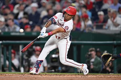 Apr 22, 2026; Washington, District of Columbia, USA;  Washington Nationals outfielder Daylen Lile (4) hits a double in the fifth inning against the Atlanta Braves at Nationals Park. Mandatory Credit: Jamie Sabau-Imagn Images