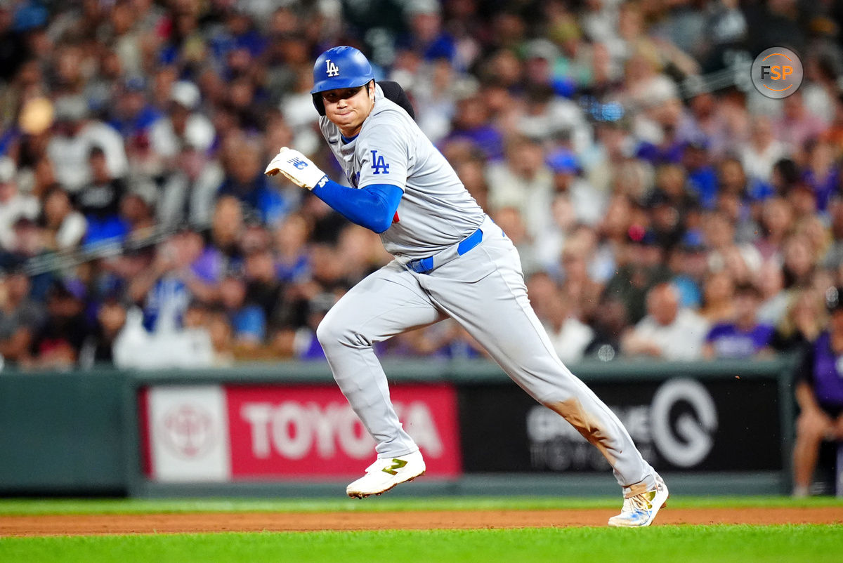 Sep 28, 2024; Denver, Colorado, USA; Los Angeles Dodgers designated hitter Shohei Ohtani (17) attempts to steal second base in the fifth inning against the Colorado Rockies at Coors Field. Credit: Ron Chenoy-Imagn Images