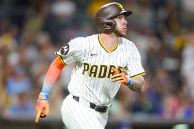 Jul 5, 2025; San Diego, California, USA; San Diego Padres center fielder Jackson Merrill (3) hits a sacrifice fly during the seventh inning against the Texas Rangers at Petco Park. Mandatory Credit: David Frerker-Imagn Images