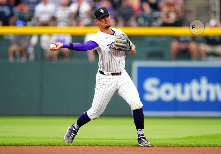 Aug 17, 2024; Denver, Colorado, USA; Colorado Rockies shortstop Ezequiel Tovar (14) fields the ball in the first inning against the San Diego Padres at Coors Field. Credit: Ron Chenoy-USA TODAY Sports