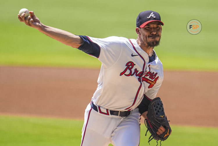 Aug 8, 2024; Cumberland, Georgia, USA; Atlanta Braves starting pitcher Charlie Morton (50) pitches against the Milwaukee Brewers during the first inning at Truist Park. Credit: Dale Zanine-USA TODAY Sports