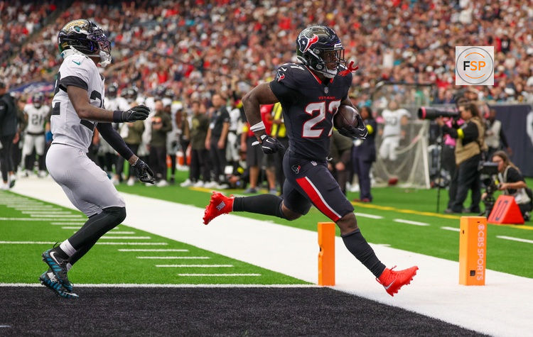 Nov 9, 2025; Houston, Texas, USA;Houston Texans running back Woody Marks (27) rushes for a touchdown against the Jacksonville Jaguars in the second half at NRG Stadium. Credit: Thomas Shea-Imagn Images