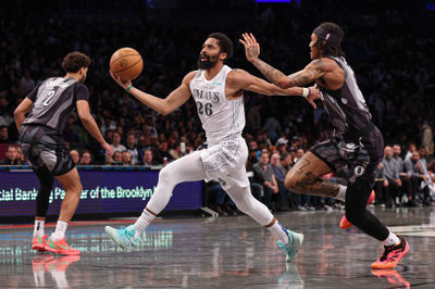 Mar 24, 2025; Brooklyn, New York, USA; Dallas Mavericks guard Spencer Dinwiddie (26) goes to the basket against Brooklyn Nets forward Maxwell Lewis (27) during the second half at Barclays Center. Mandatory Credit: Vincent Carchietta-Imagn Images