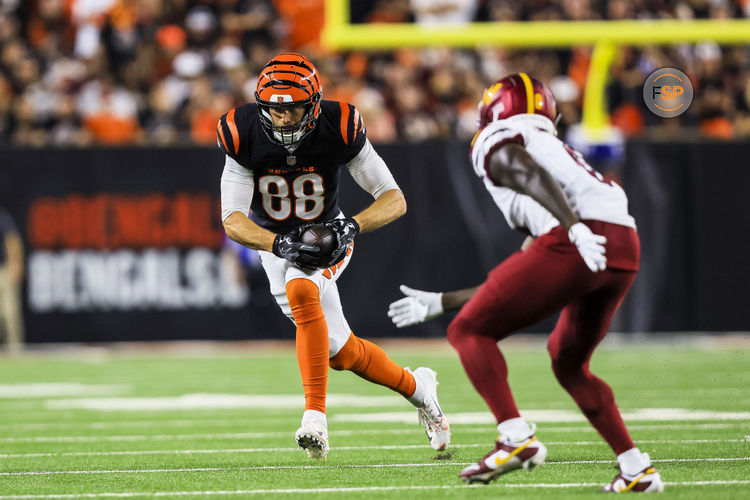 Sep 23, 2024; Cincinnati, Ohio, USA; Cincinnati Bengals tight end Mike Gesicki (88) runs with the ball Washington Commanders cornerback Mike Sainristil (0) in the second half at Paycor Stadium. Credit: Katie Stratman-Imagn Images