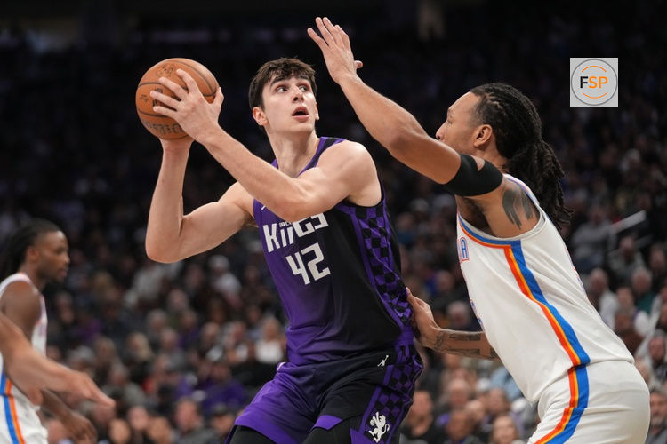 Nov 7, 2025; Sacramento, California, USA; Sacramento Kings center Maxime Raynaud (42) holds onto the ball next to Oklahoma City Thunder forward Jaylin Williams (6) in the second quarter at the Golden 1 Center. Credit: Cary Edmondson-Imagn Images