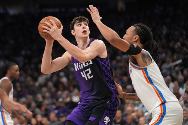 Nov 7, 2025; Sacramento, California, USA; Sacramento Kings center Maxime Raynaud (42) holds onto the ball next to Oklahoma City Thunder forward Jaylin Williams (6) in the second quarter at the Golden 1 Center. Mandatory Credit: Cary Edmondson-Imagn Images