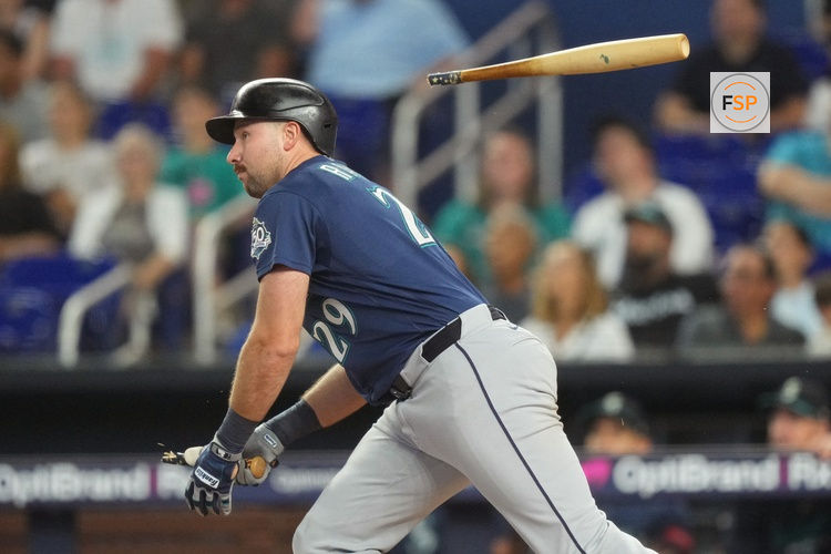 Jul 8, 2026; Miami, Florida, USA;  Seattle Mariners catcher Cal Raleigh (29) breaks his bat while hitting a bloop single in the first inning against the Miami Marlins at loanDepot Park. Credit: Jim Rassol-Imagn Images