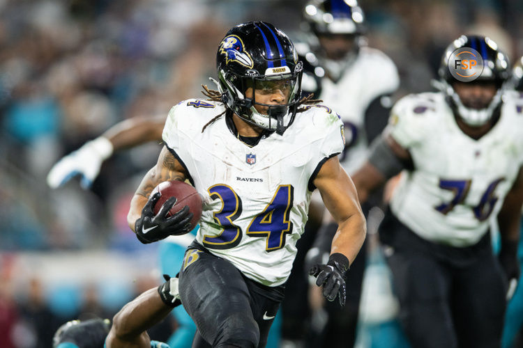 Dec 17, 2023; Jacksonville, Florida, USA; Baltimore Ravens running back Keaton Mitchell (34) runs the ball against the Jacksonville Jaguars in the fourth quarter at EverBank Stadium. Credit: Jeremy Reper-USA TODAY Sports