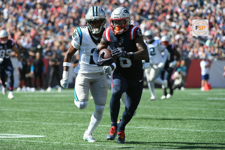 Sep 28, 2025; Foxborough, Massachusetts, USA; New England Patriots wide receiver Stefon Diggs (8) runs with the ball while Carolina Panthers cornerback Mike Jackson (2) defends during the first half at Gillette Stadium. Credit: Bob DeChiara-Imagn Images