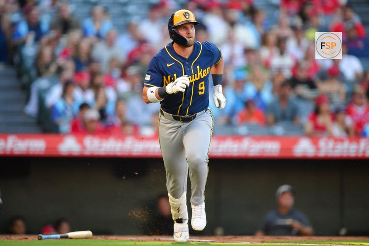 Jul 31, 2026; Anaheim, California, USA; Milwaukee Brewers first baseman Jake Bauers (9) runs after hitting a single against the Los Angeles Angels during the second inning at Angel Stadium. Credit: Gary A. Vasquez-Imagn Images