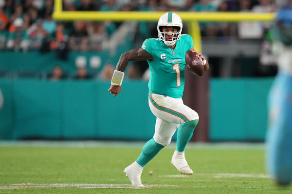 MIAMI GARDENS, FL - DECEMBER 11: Miami Dolphins quarterback Tua Tagovailoa (1) scrambles with the ball during the game between the Tennessee Titans and Miami Dolphins on Monday, Dec. 11, 2023 at Hard Rock Stadium, Miami Gardens, Fla. (Photo by Peter Joneleit/Icon Sportswire)