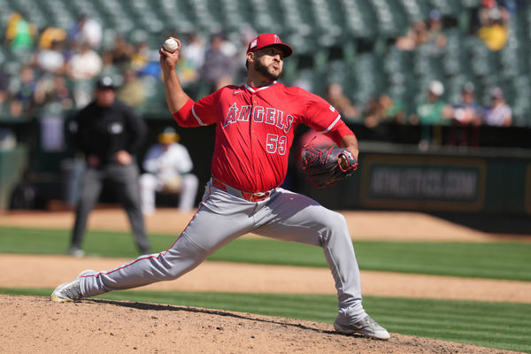 Jul 21, 2024; Oakland, California, USA; Los Angeles Angels relief pitcher Carlos Estevez (53) throws a pitch against the Oakland Athletics during the ninth inning at Oakland-Alameda County Coliseum. Mandatory Credit: Darren Yamashita-USA TODAY Sports