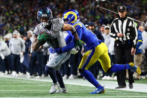 Dec 18, 2025; Seattle, Washington, USA; Seattle Seahawks wide receiver Jaxon Smith-Njigba (11) runs against Los Angeles Rams cornerback Darious Williams (31) in the second half at Lumen Field. Mandatory Credit: Kevin Ng-Imagn Images