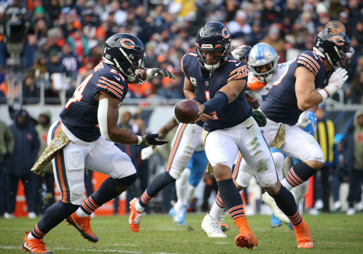 CHICAGO, IL - NOVEMBER 13: Chicago Bears quarterback Justin Fields (1) hands the ball off to Chicago Bears running back Khalil Herbert (24) during a game between the Detroit Lions and the Chicago Bears on November 13, 2022 at Soldier Field in Chicago, IL. (Photo by Melissa Tamez/Icon Sportswire)