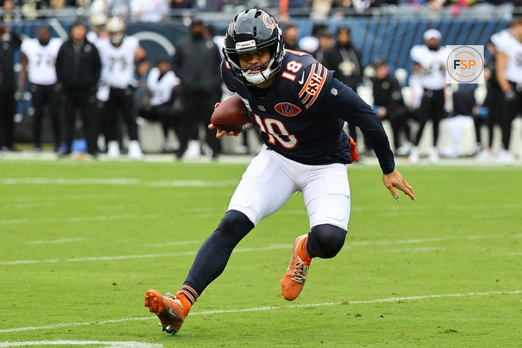 Oct 19, 2025; Chicago, Illinois, USA; Chicago Bears quarterback Caleb Williams (18) rushes the ball against the New Orleans Saints during the first quarter at Soldier Field. Credit: Mike Dinovo-Imagn Images