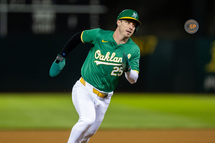 Sep 20, 2024; Oakland, California, USA; Oakland Athletics outfielder Brent Rooker (25) scores during the tenth inning against the New York Yankees at Oakland-Alameda County Coliseum. Credit: Bob Kupbens-Imagn Images