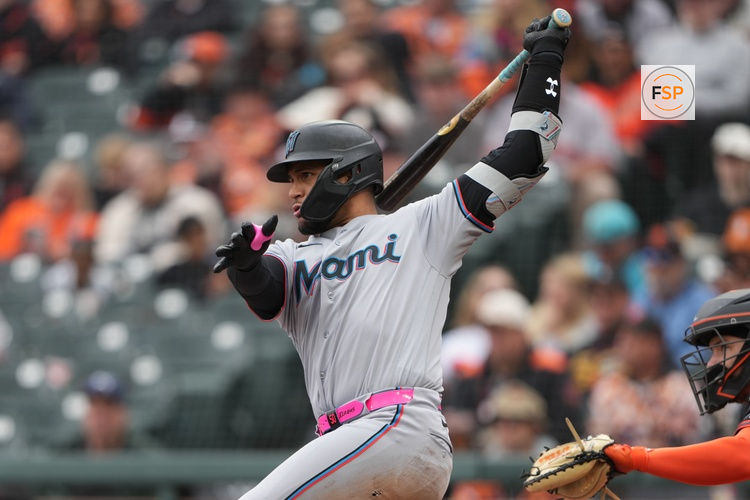 Apr 25, 2026; San Francisco, California, USA; Miami Marlins catcher Agustin Ramirez (50) hits a single against the San Francisco Giants during the fifth inning at Oracle Park. Credit: Darren Yamashita-Imagn Images