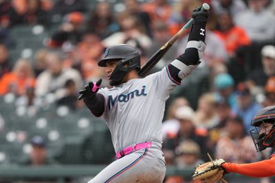 Apr 25, 2026; San Francisco, California, USA; Miami Marlins catcher Agustin Ramirez (50) hits a single against the San Francisco Giants during the fifth inning at Oracle Park. Mandatory Credit: Darren Yamashita-Imagn Images