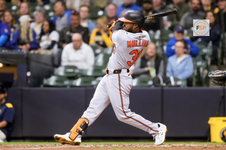 May 19, 2025; Milwaukee, Wisconsin, USA;  Baltimore Orioles center fielder Cedric Mullins (31) hits a home run during the seventh inning against the Milwaukee Brewers at American Family Field. Credit: Jeff Hanisch-Imagn Images