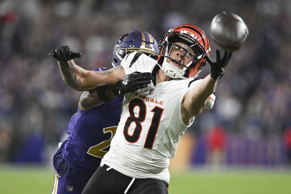 Nov 7, 2024; Baltimore, Maryland, USA; Cincinnati Bengals wide receiver Jermaine Burton (81) reaches for quarterback Joe Burrow (not pictured) throws ass Baltimore Ravens cornerback Brandon Stephens (21) defends during the second half   at M&T Bank Stadium. Mandatory Credit: Tommy Gilligan-Imagn Images