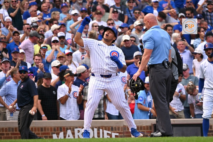 Sep 13, 2025; Chicago, Illinois, USA; Chicago Cubs designated hitter Moises Ballesteros (25) crosses home plate and celebrates his first MLB home run against the Tampa Bay Rays during the second inning at Wrigley Field. Credit: Patrick Gorski-Imagn Images
