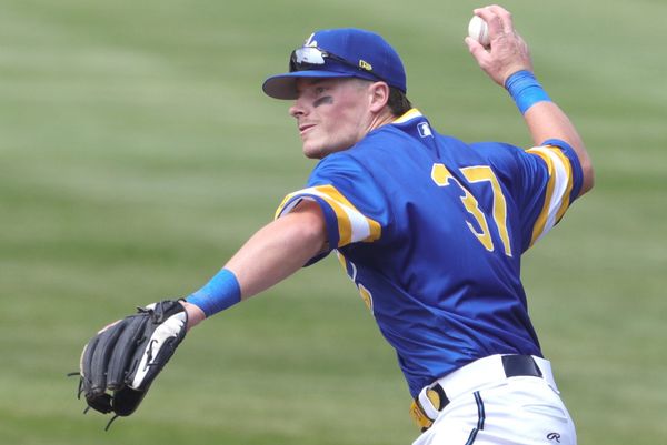 RubberDucks second baseman Travis Bazzana throws to first base in a game against the Altoona Curve on April 13, 2025, in Akron, Ohio.