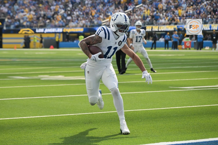 Oct 19, 2025; Inglewood, California, USA; Indianapolis Colts wide receiver Michael Pittman Jr. (11) runs the ball for a touchdown in the first quarter against the Los Angeles Chargers at SoFi Stadium. Credit: Jayne Kamin-Oncea-Imagn Images