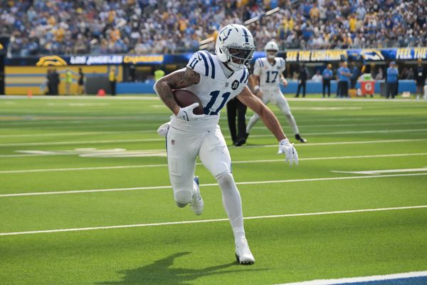 Oct 19, 2025; Inglewood, California, USA; Indianapolis Colts wide receiver Michael Pittman Jr. (11) runs the ball for a touchdown in the first quarter against the Los Angeles Chargers at SoFi Stadium. Mandatory Credit: Jayne Kamin-Oncea-Imagn Images